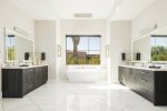 Master bathroom with dual vanity & free standing bathtub 